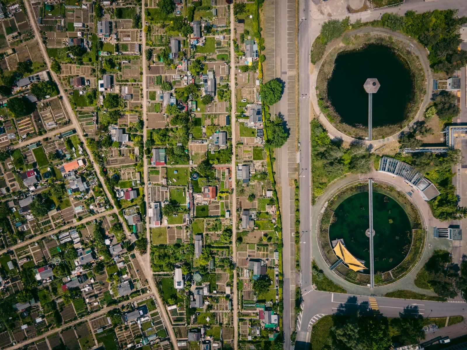 Aerial reference photograph of circular clarifiers and water treatment infrastructure